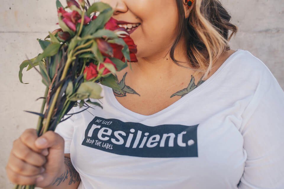 Woman living in the present and smelling roses