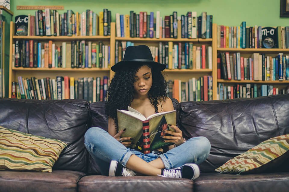 Woman focusing while reading a book