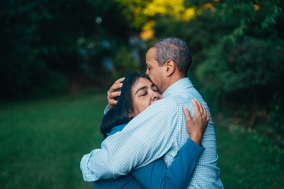 Man and woman hugging emotionally