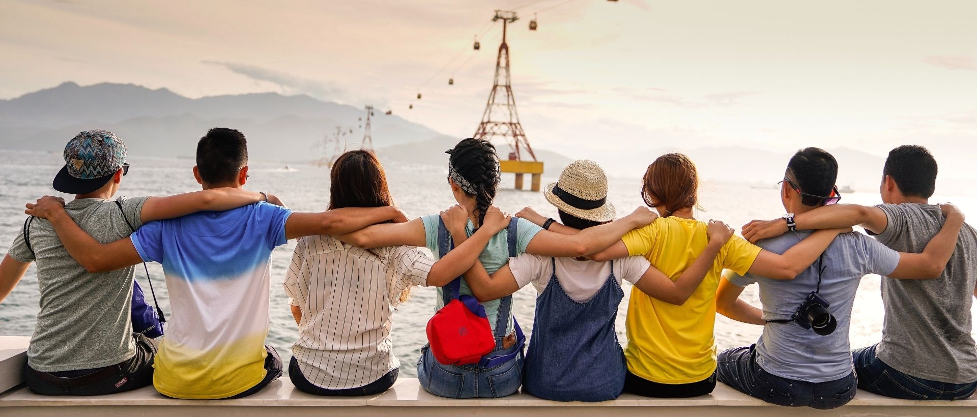 a group of people sitting next to each other.