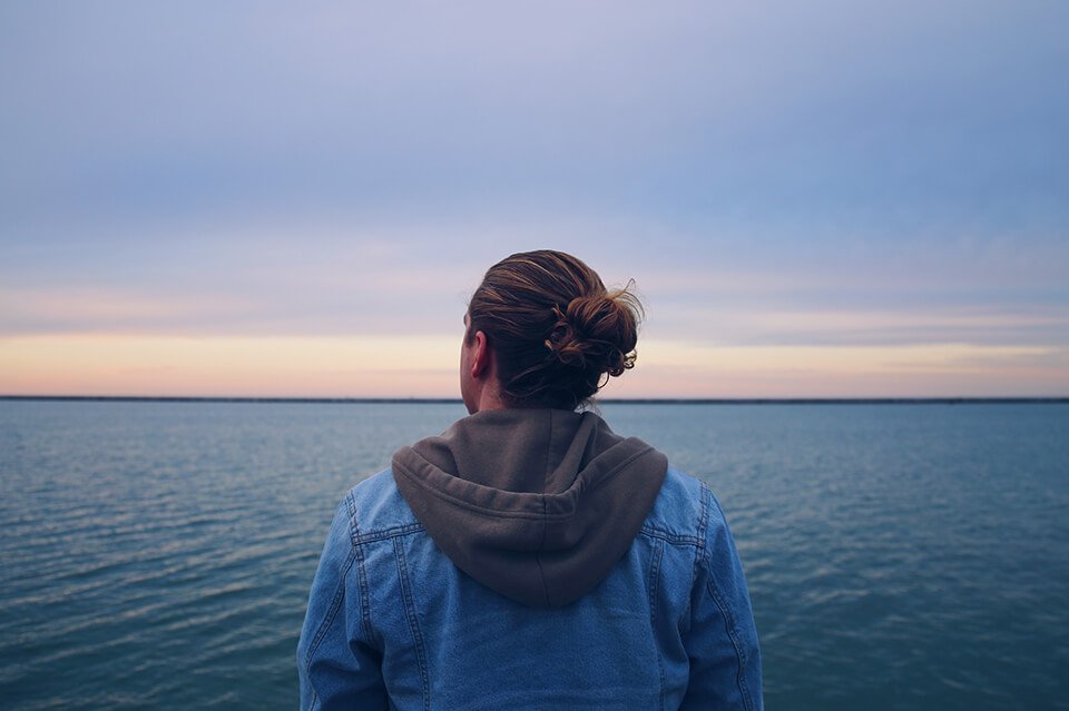 Man standing lost in thought