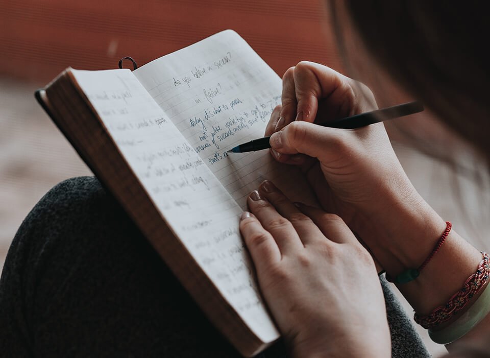 Woman writing in her journal