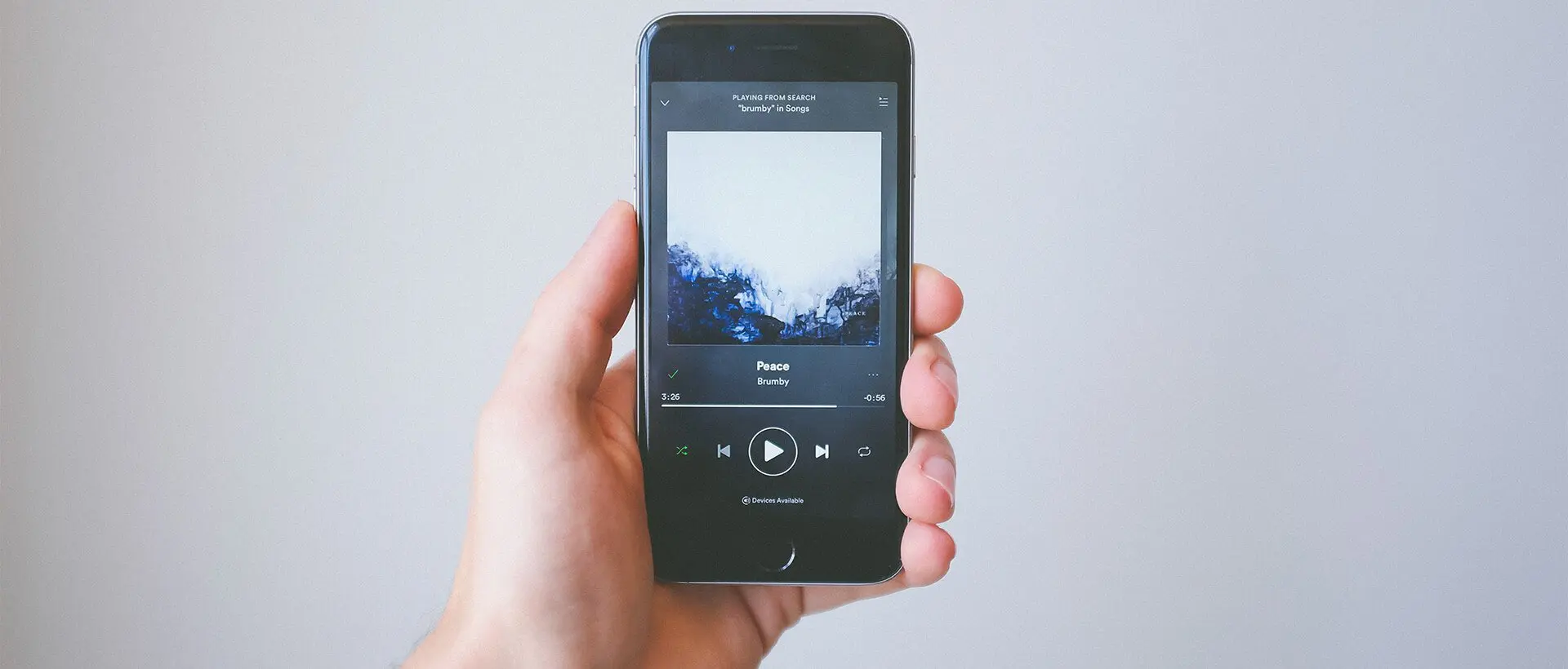 a person holding a cell phone in their hand.