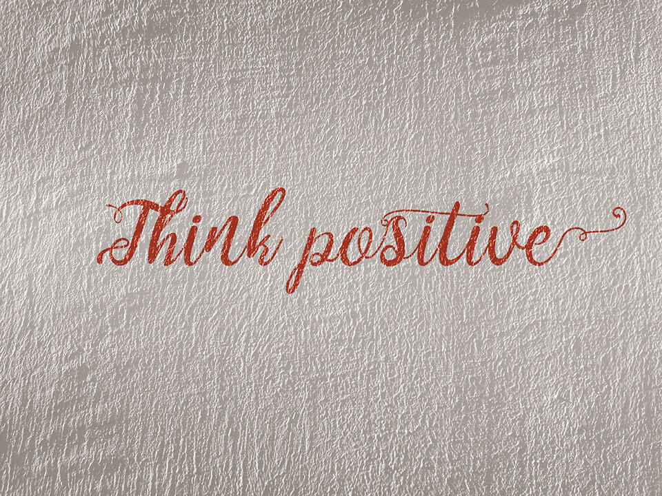 "Think positive" written on wall