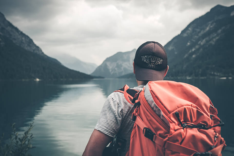 Man looking off into a lake