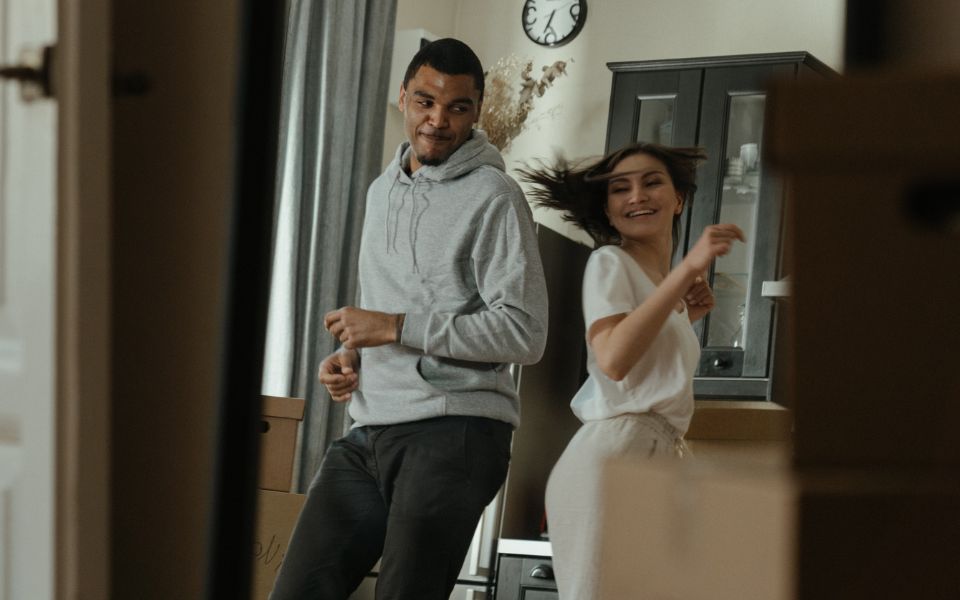 young couple dancing in a room